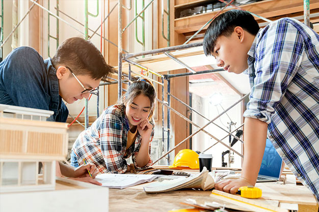 Engineering students working on projects in mechanical, civil, and electrical engineering"