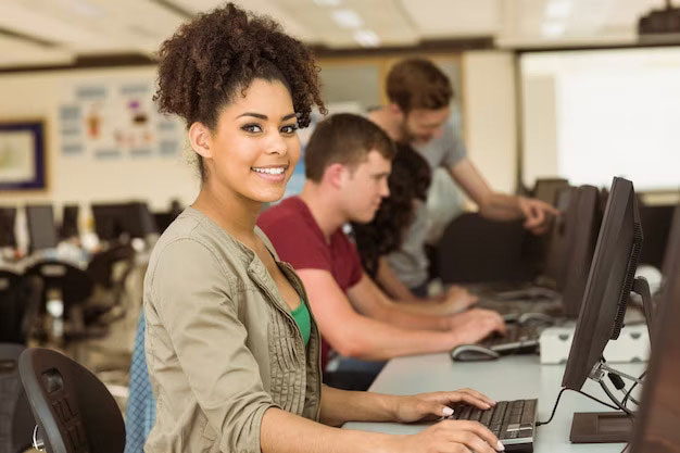 Students studying information technology and software development in an IT course